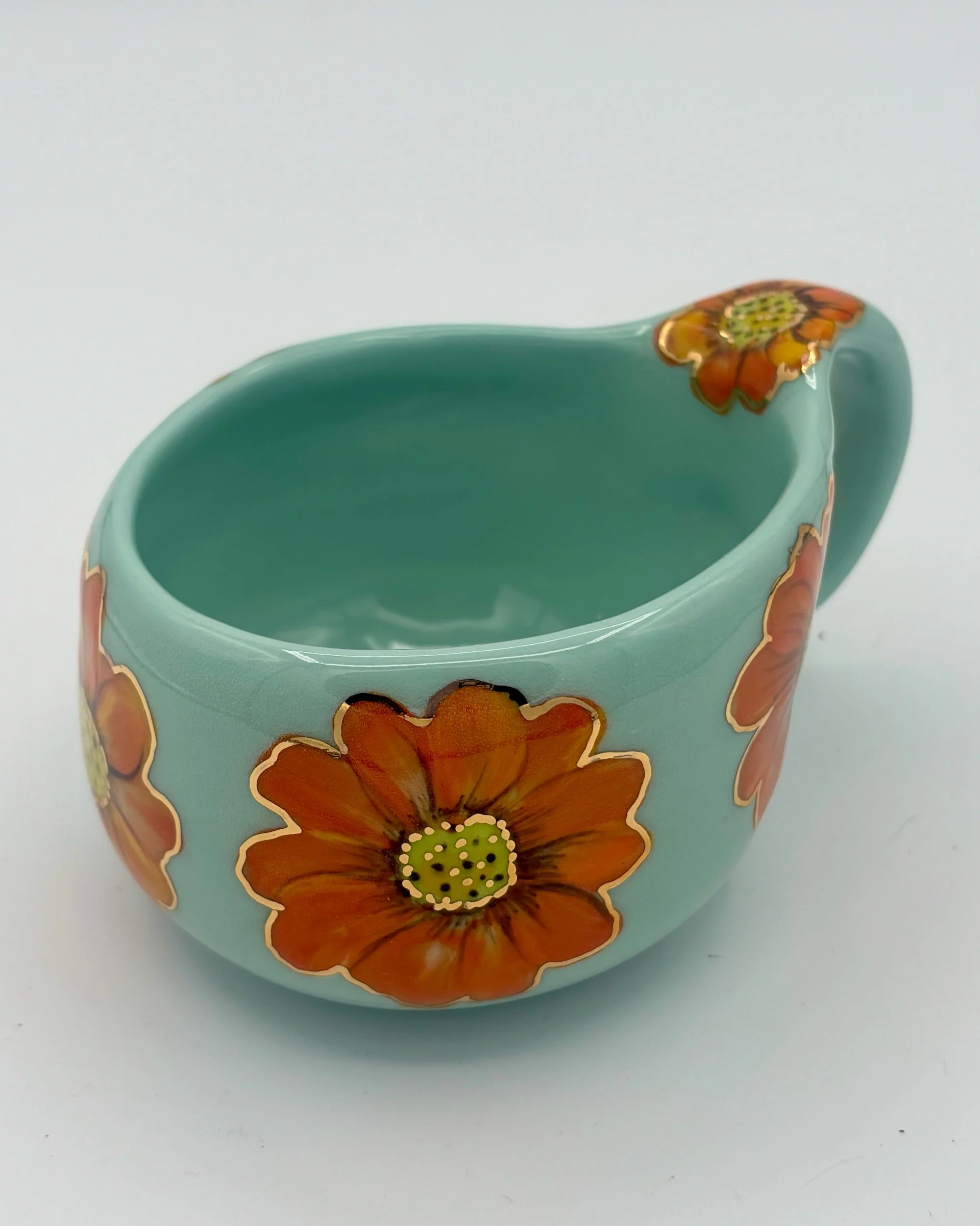 Small cappuccino cup with golden flowers