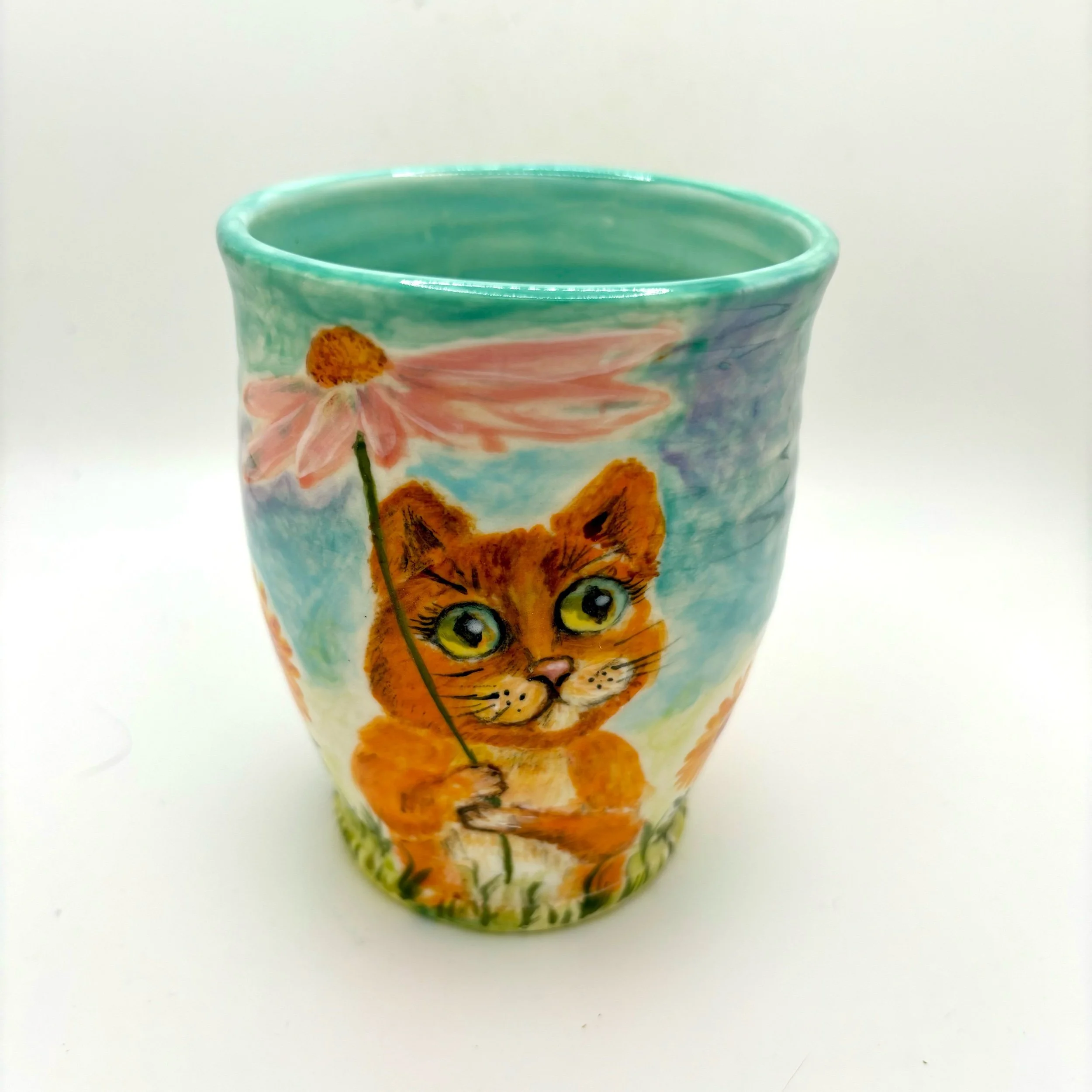 Two cats with flowers cup